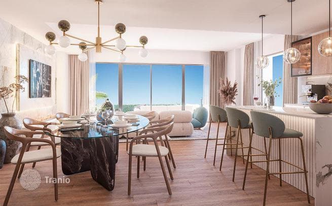 Beachfront Townhouses with Golf Course Views and Garden in Mijas